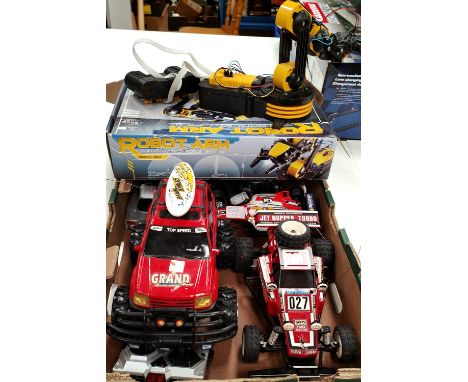 A selection of loose Taiyo and other remote controlled vehicles a robot arm etc 