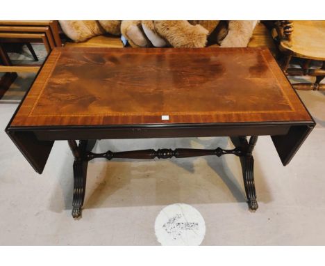 A reproduction crossbanded mahogany dwarf sofa table 