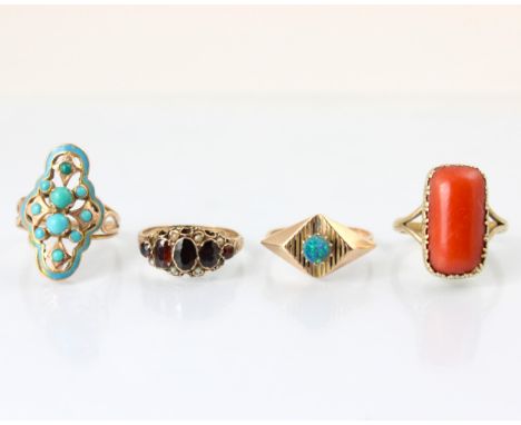 A selection of four dress rings, including a late 19th century style coral ring, within cut down style yellow metal setting e