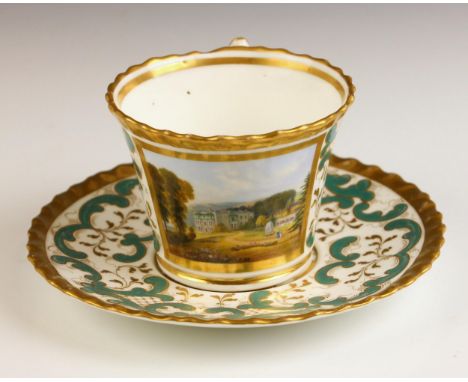 A Chamberlain & Co. Worcester cup and saucer, painted with a view of Holly Mount, Malvern, against a gilt highlighted scrolli