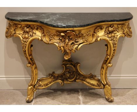 A giltwood console table, in the Louis XVI style, late 19th century, the verte marble top over a leaf and shell moulded apron