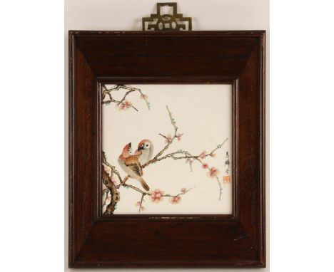 A Chinese porcelain plaque, possibly Republic Period, of square section and painted with two birds perched upon a branch of p