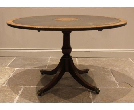 A rosewood veneered and green leather circular pedestal table, by G.T Rackstraw, Worcester, 20th century, the table top appli
