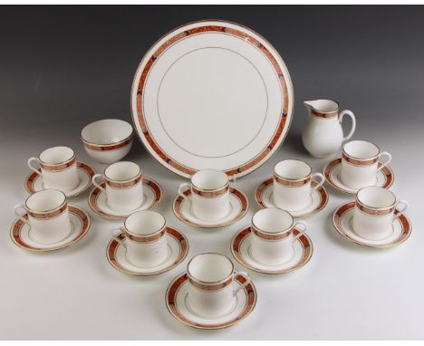 A Royal Worcester part coffee service in the 'Beaufort (Rust)' pattern, comprising: ten coffee cans, ten saucers, a cream jug