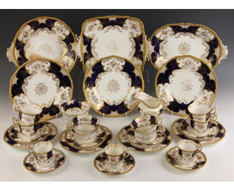 A selection of Coalport cobalt blue batwing decorated tea and coffee wares, comprising: five teacups, seven coffee cups, six 