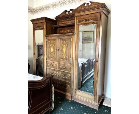 A Thomas Edwards &amp; Sons rosewood and inlaid gentleman’s compactum wardrobe, of architectural form, the central section wi