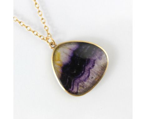 A 9ct yellow gold Blue John pendant, the triangular slice of Blue John within plain polished mount, stamped to the reverse ‘H