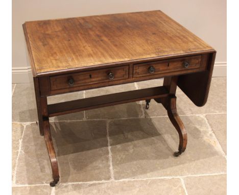 A Regency mahogany sofa table, the crossbanded, drop-leaf top with rounded corners over a pair of frieze drawers inlaid with 