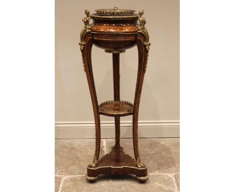 A 19th century style French walnut and kingwood jardiniere stand, inlaid with foliate and scroll motifs and applied with gilt