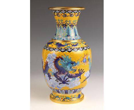 A Chinese yellow cloisonne vase, 20th century, of baluster form and decorated with a phoenix and dragon chasing a flaming pea