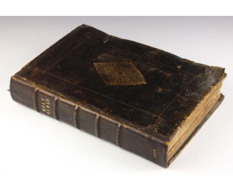 A Geneva or 'breeches' Bible, early 17th century, pulpit folio, full leather, gilt embossed decoration to boards, metal clasp