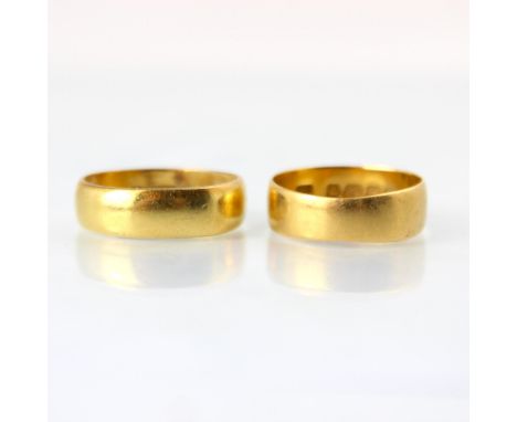 An early 20th century 22ct yellow gold wedding band, stamped 'SH' Birmingham possibly 1912, ring size L 1/2, with a further 2