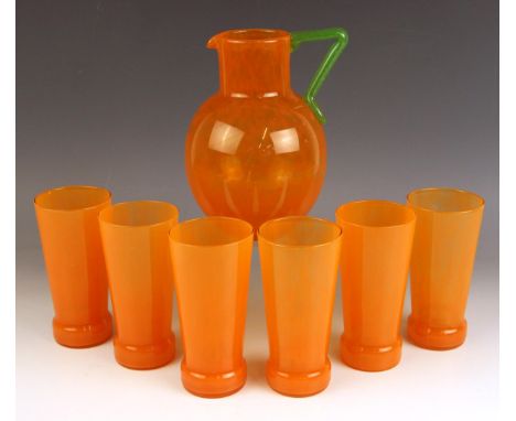 An Art Deco tangerine glass lemonade set by Charles Schneider, early 20th century, the jug of bulbous form with straight neck