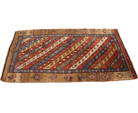 A Sarab hand knotted wool rug, the central field with alternating red, green, blue and white diagonal bands, enclosed by a mu