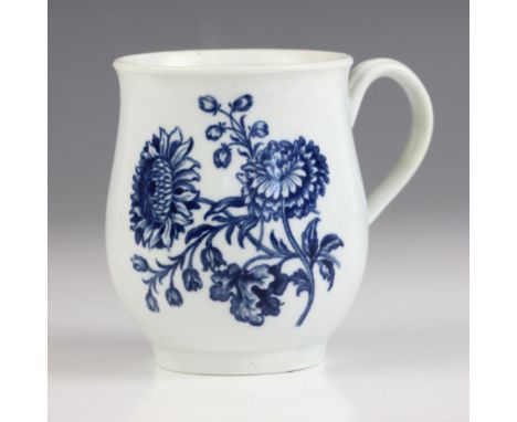A first period Worcester porcelain mug, circa 1770, of bell form printed in underglaze blue with  the ‘Natural Sprays Group’ 