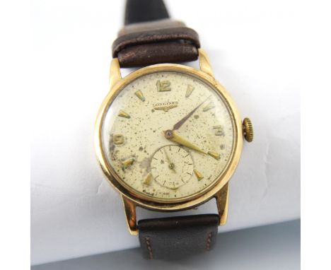 A yellow metal cased Longines wristwatch, the cream circular dial with arrow and Arabic markers and subsidiary dial to 6 o'cl