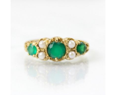 A 9ct yellow gold Victorian style untested emerald and pearl ring, the central round cut green stone set with paste pearl det