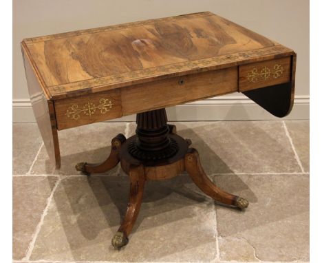 A Regency rosewood and brass inlaid sofa table, in the manner of George Bullock, the drop leaf top with rounded corners inlai