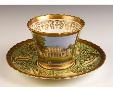A Chamberlain & Co. Worcester cup and saucer, painted with a view of Frogmore House, against a gilt highlighted green ground,