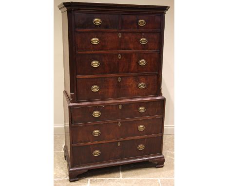A George III mahogany chest on chest, the moulded Greek key pattern cornice over an arrangement of two short and three gradua