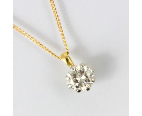 A diamond solitaire necklace, the round cut diamond within white metal claw setting, with yellow metal to the reverse, upon a