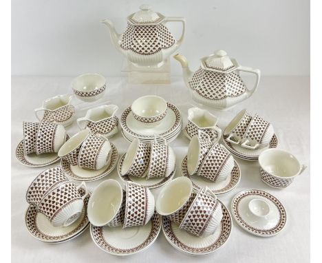 A collection of ceramic Adams "Sharon" shamrock pattern teaware. Comprising: 2 teapots, 3 milk jugs, 2 sugar bowls, 6 tea pla