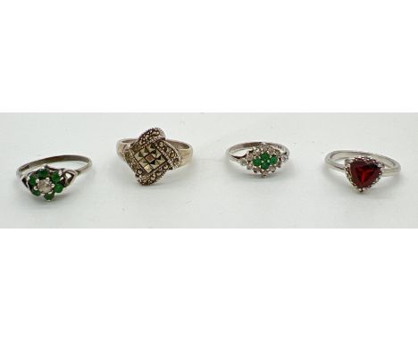 4 stone set silver dress rings. A modern square design ring set with marcasite stones, a vintage flower head ring set with a 