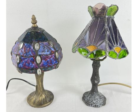 2 metal based Tiffany style table lamps with coloured glass leaded shades. A lamp with hexagonal shaped shade with sunrise de