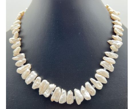 A 16" Heishi freshwater pearl necklace with crystal beaded ends and silver tone T bar clasp. Retired jewellery makers stock. 