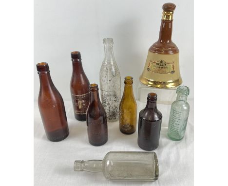 A small collection of vintage ceramic and glass bottles to include: Bells Whisky; Adnams, Southwold; Crawshay &amp; Youngs, N