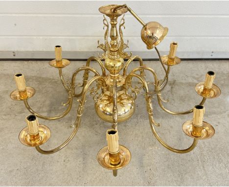 A large vintage 8 arm brass electrical ceiling light fitting with classical fish detail. Approx. 86cm diameter x 70cm drop. 