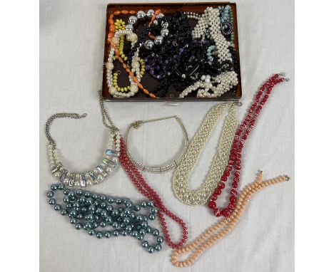 A box of vintage plastic bead and faux pearl necklaces. to include statement and collar style. 
