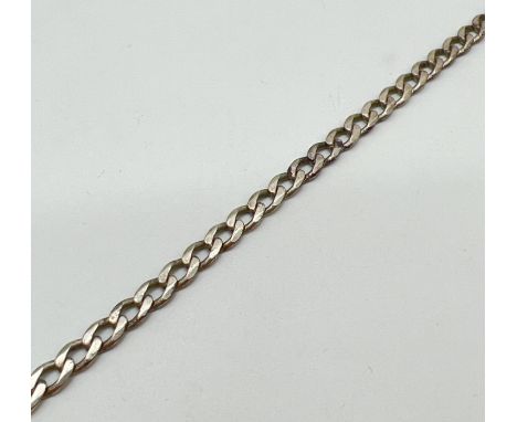 A vintage silver 9 inch curb chain bracelet with lobster clasp. Marked 925 with scales mark to fixing and clasp. Total weight