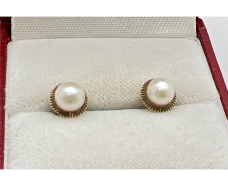 A pair of vintage 18ct gold pearl set stud earrings for pierced ears. Without butterfly backs. Test as 18ct gold. Total weigh