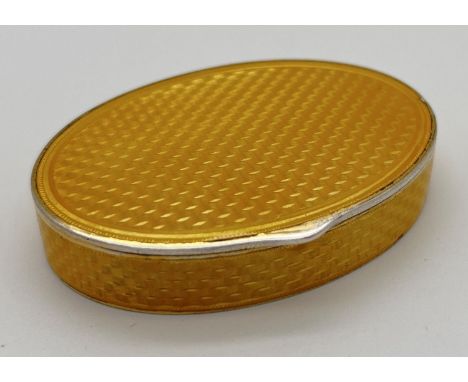 An early 20th century Marius Hammer Norwegian silver, Asprey oval shaped snuff box with yellow guilloche decoration. Gilt int