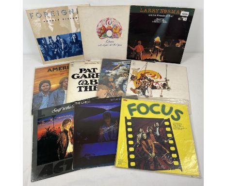 10 vintage mixed genre music LP records to include electronic and rock. Artists include Foreigner, Queen Larry Norman, Americ