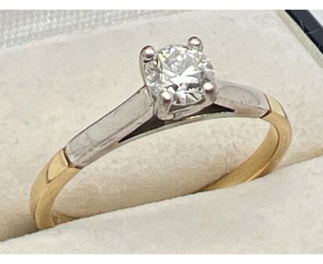 An 18ct gold .33ct diamond solitaire ring. Full hallmarks to inside of band. Total weight approx 2.7g. Size N. 