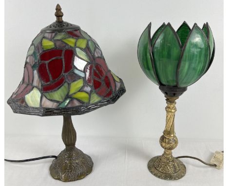 2 metal based Tiffany style table lamps with leaded coloured glass shades. A gilt based lamp with green glass uplighter shade