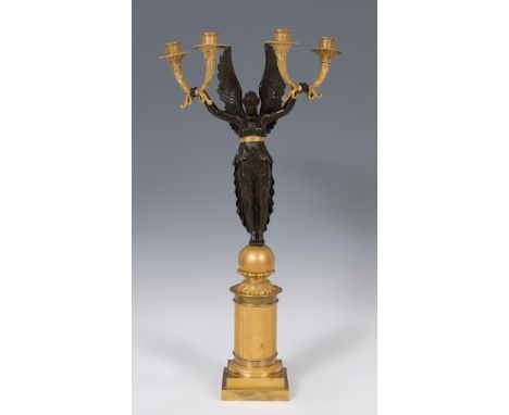 Candelabra with Athena Nike after Empire models of ca. 1810. France, 19th century.Gilt and patinated bronze.It presents insta