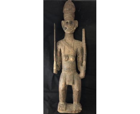 Ethnographic Native Tribal - a Pacific / Oceanic Borneo carved wooden figure of a soldier carrying a Club and a firearm ( rif