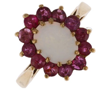 A late 20th century 9ct gold opal and ruby oval cluster ring, London 1978, claw set with oval cabochon opal and round-cut rub