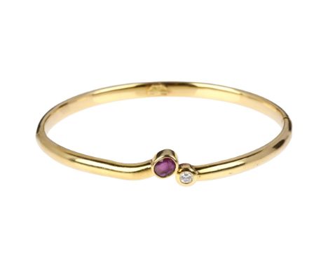 An Italian 18ct gold two stone ruby and diamond hinged bangle, maker B&C Gioielli within wings, rub-over set with oval mixed-