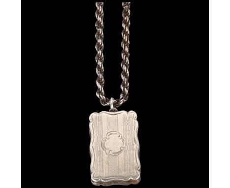 A Victorian silver vinaigrette, James Fenton, Birmingham 1855, shaped rectangular form, with engine turned decoration, gilt i