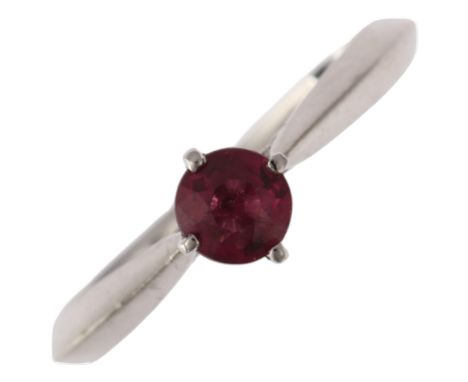 A platinum almandine garnet and diamond ring, claw set with round-cut garnet and single-cut diamond bridge, setting height 5.