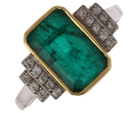 An Art Deco style emerald and diamond dress ring, mid-20th century, rub-over set with 1.9ct octagonal step-cut emerald flanke