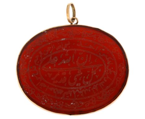 An Islamic carnelian Arabic talisman amulet pendant, unmarked yellow metal frame, width 37mm, 5gNo damage or repair, a few mi