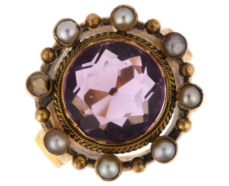 A large 19th century amethyst and pearl openwork ring, circa 1820, central rub-over set round-cut amethyst within openwork ro