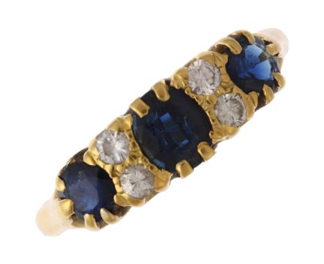 An early 20th century 18ct gold seven stone sapphire and diamond half hoop ring, set with oval and round-cut sapphires with m