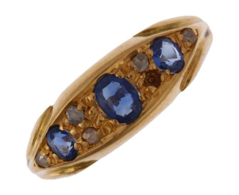 An early 20th century 18ct gold sapphire and diamond half hoop ring, indistinct hallmarks, setting height 6.1mm, size K, 2.1g