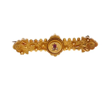 A Victorian 15ct gold ruby and diamond Etruscan Revival brooch, circa 1890, central floral motif within rope twist surround, 